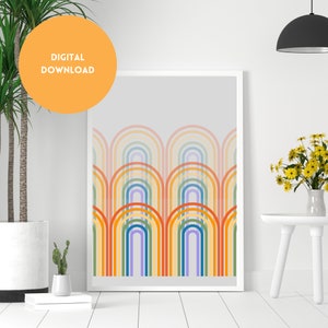 Op de afbeelding: Een digitale download van een printbare kunstprint met een geometrisch patroon van kleurrijke regenboogbogen op een lichtgrijze achtergrond.