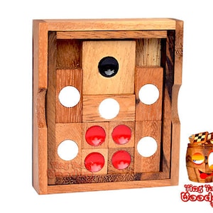 Peut inclure: Un jeu de société en bois avec un puzzle coulissant comportant des cercles rouges et blancs. Le jeu s'appelle "Ting Tong Wooden Games".