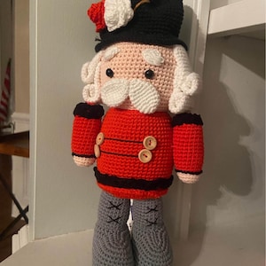 Handmade Crocheted Nutcracker Doll  Unique Holiday Decoration for Festive Home and Gifts Adorable Christmas Ornament for Winter Celebrations