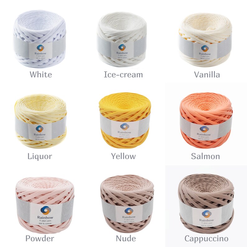 May include: Nine balls of yarn in different colors, including white, ice cream, vanilla, liquor, yellow, salmon, powder, nude, and cappuccino. Each ball is labeled "Rainbow" and has a small circle with a rainbow inside.