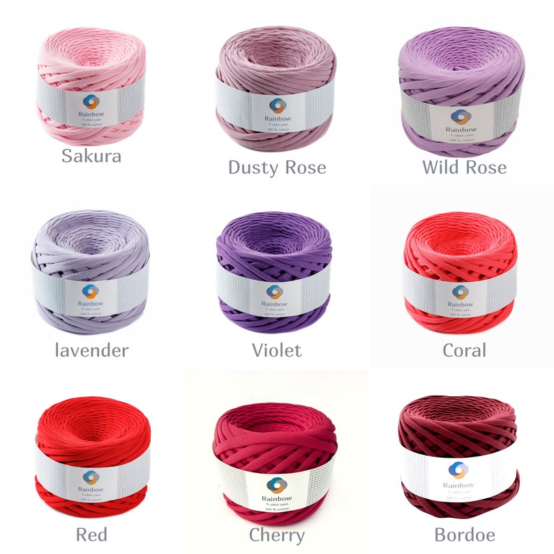 May include: Nine spools of rainbow yarn in various shades of pink, purple, and red. The yarn is made of cotton and is perfect for crocheting or knitting.