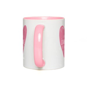 May include: White ceramic mug with a pink rim and handle. The mug has a pink heart design with the text "La vita &egrave; come una tazza di caff&egrave;" in white.