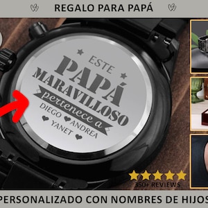 May include: Black chronograph watch with a personalized engraving on the back. The watch features a black band and face. The engraving reads "ESTE PAPÁ MARAVILLOSO pertenece a DIEGO ANDREA YANET". The text "REGALO PARA PAPÁ" is at the top.