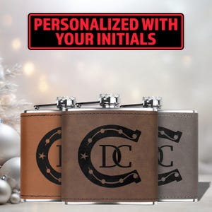 May include: Three brown leather-wrapped hip flasks with silver tops. Each flask features a horseshoe design with a star and initials engraved inside. The middle flask has the initials "DC". The text "Personalized with your initials" is displayed above the flasks.