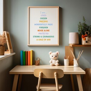 color affirmation printable for kids in a frame above a kids desk