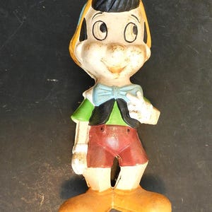 ViNTAGE LArGE C0LORFUL CAST IR0N DiSNEY PIN0CCHIO W0ODEN B0Y CHARACTER C0IN BANK/10&quot;