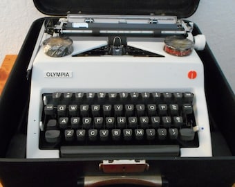 Vintage 1970's Olympia SM9 Deluxe typewriter with case, ribbons, and more, vintage typewriters, vintage Olympia typewriters, vintage SM9
