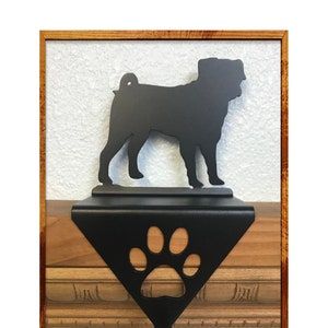 May include: Black metal stocking holder featuring a pug silhouette and a paw print design.