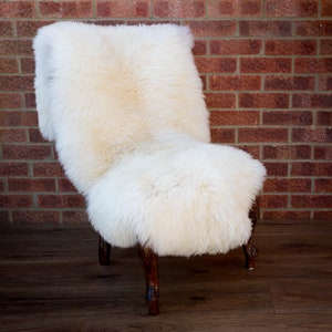 Cream white sheep rug on chair