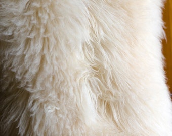 Ethically sourced Sheepskin Rug white cream colour, genuine sheepskin throw for chair. Sizes small and large sheep pelts