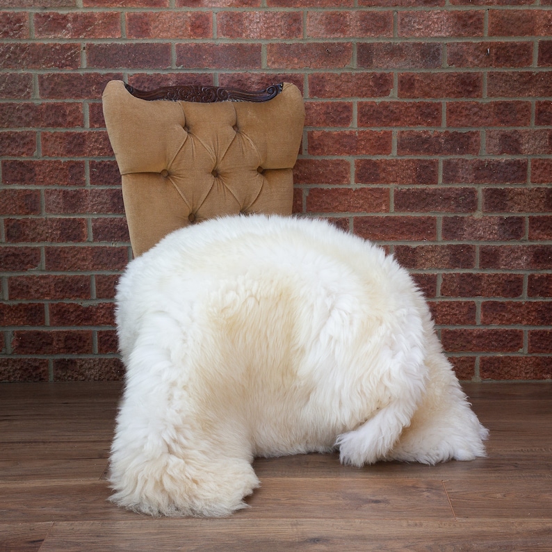 Cream white sheepskin rug on chair