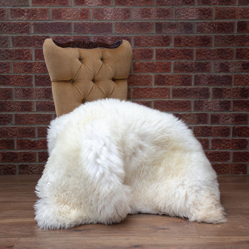 Cream white sheepskin rug on chair