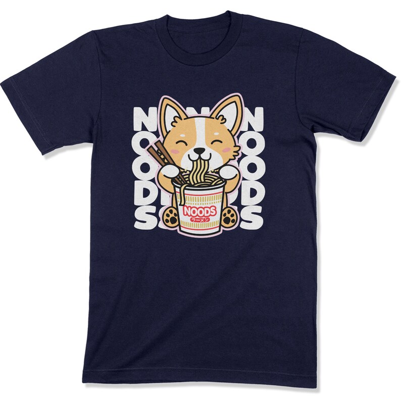 May include: A navy blue t-shirt with a cartoon corgi dog eating a bowl of noodles. The text "NOODS" is repeated around the dog.