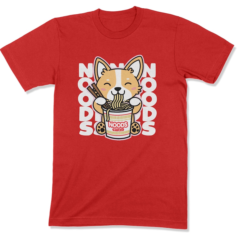 May include: A red t-shirt with a cartoon image of a corgi eating noodles from a red and white bowl. The bowl says 'NOODS' in white letters. The words 'NOODS' are repeated in a vertical pattern on the shirt.