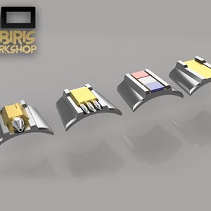 May include: Four different types of 3D printed nozzle tips for a hot glue gun. The nozzles are silver with gold accents and are arranged in a row from left to right.