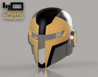 May include: A 3D printed helmet with a black, gold, and silver colour scheme. The helmet has a visor and a design that resembles a futuristic warrior.