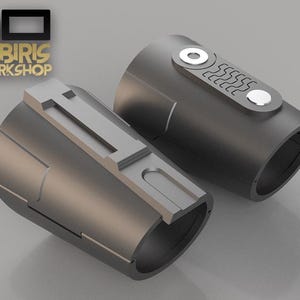 May include: Two cylindrical, dark gray metal objects with silver accents. One has a series of five horizontal lines and two circular silver details. The other has a rectangular silver detail. The logo "CABIRIS WORKSHOP" is in gold.