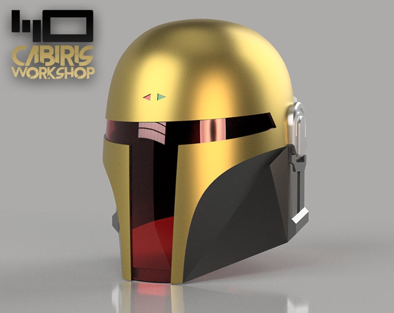 May include: A gold helmet with a black visor and red accents. The helmet has a small, rectangular panel on the side with a green and blue light.