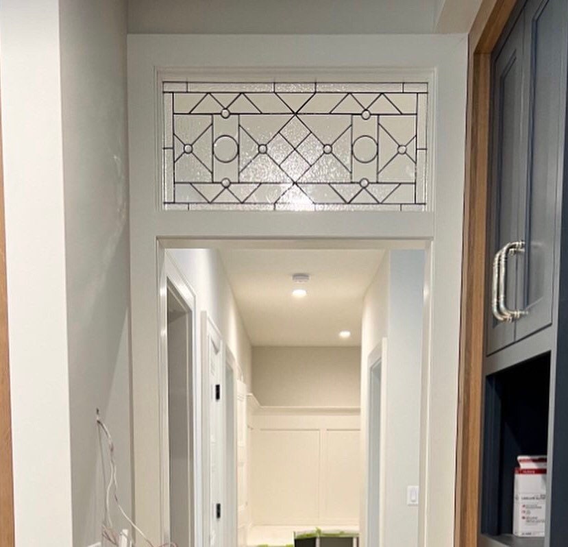 22-04 Custom stained glass transom window in clear textures and beveled glass