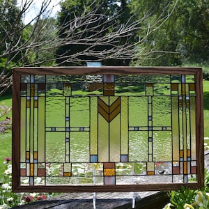 23-04 Frank Lloyd Wright Prairie Style stained glass window. 1 3/8” wide, dk. walnut stained oak frame. Custom available