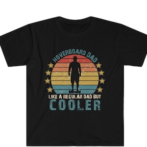 May include: Black t-shirt with a vintage-style graphic of a person riding a hoverboard. The graphic says "Hoverboard Dad Like a Regular Dad But Cooler".