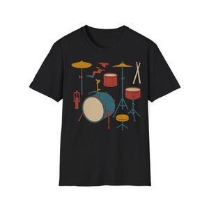 May include: Black t-shirt featuring a retro-style illustration of a drum set. The design includes a large blue drum, red drums, yellow cymbals, and drumsticks. A fun graphic tee for music lovers.