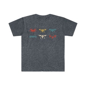May include: Dark heather gray t-shirt featuring a retro design of six drones in various colors. The drones are arranged in two rows of three, with colors including red, yellow, teal, and white. The shirt has a classic crew neck.