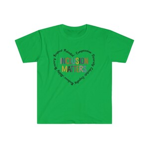 May include: Green t-shirt with a circular design that says "Inclusion Matters" surrounded by the words "Respect, Potential, Compassion, Diversity, Embrace, Empathy, Kindness, Bravery,  Equality,  Adult".