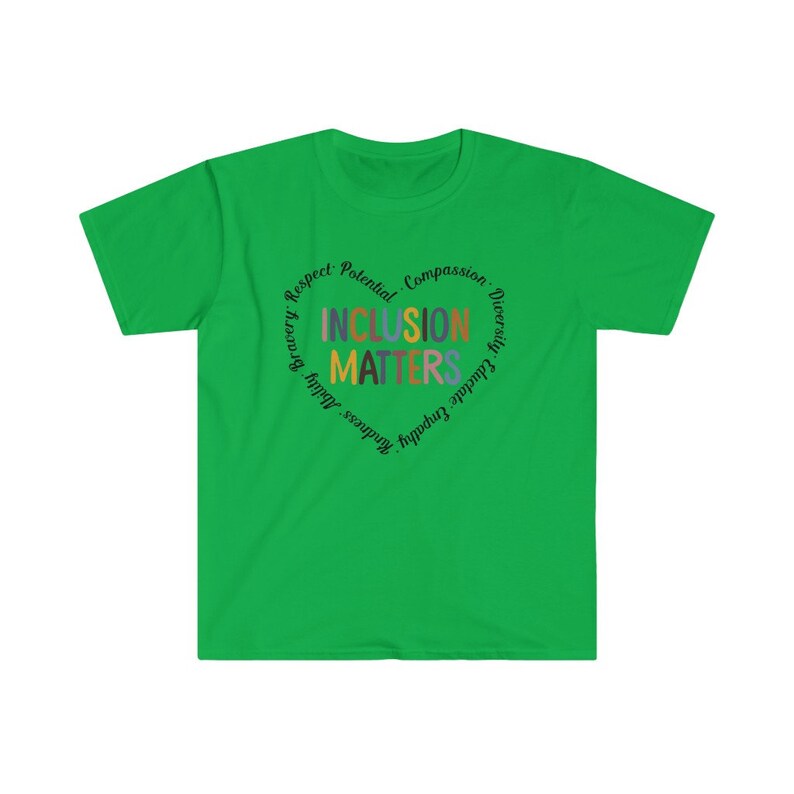 May include: Green t-shirt with a circular design that says "Inclusion Matters" surrounded by the words "Respect, Potential, Compassion, Diversity, Embrace, Empathy, Kindness, Bravery,  Equality,  Adult".