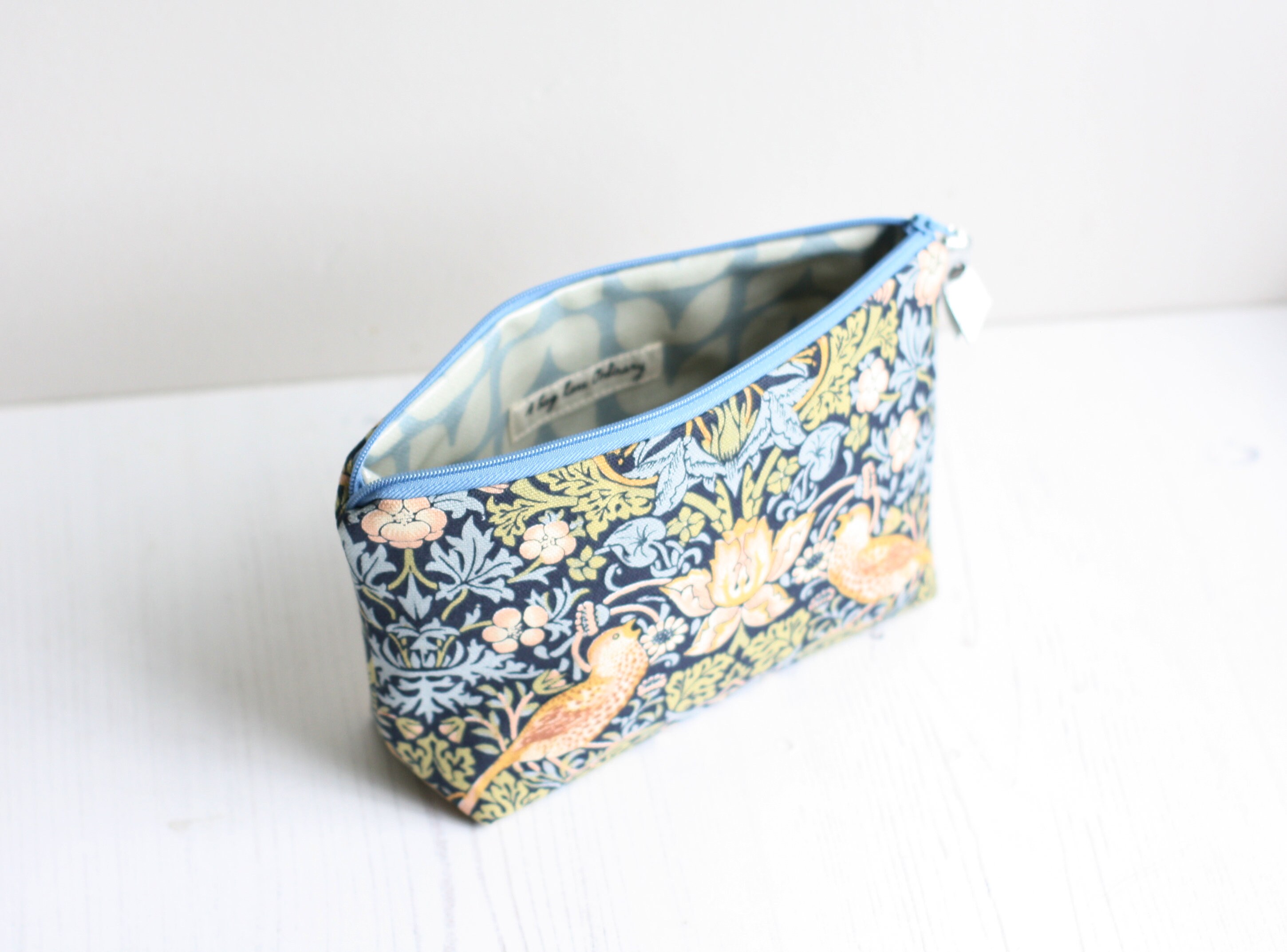 Blue fabric toiletry bag with waterproof lining made from a Etsy