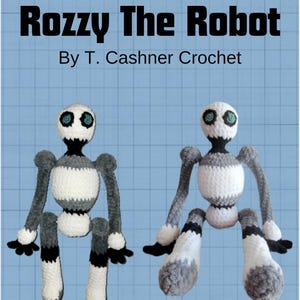 May include: Two crocheted robot toys, one sitting upright and the other sitting with legs crossed. Both robots are white and gray with black accents and have teal eyes. The title "Rozzy The Robot" and "By T. Cashner Crochet" are printed above the robots.