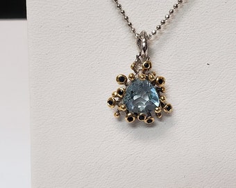 Blue topaz and sapphire 14k and sterling silver pendant