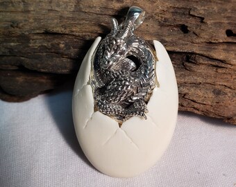 Dragon egg pendant, handcrafted bone and sterling silver.