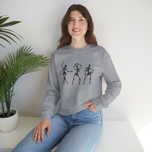 Skeleton Shuffle Spooky and Stylish Halloween Unisex Crewneck Heavy Blend Sweatshirt