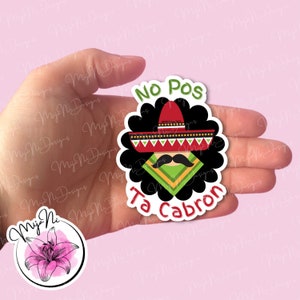 May include: A black and white sticker with a cartoon illustration of a person wearing a sombrero and a mustache. The text "No Pos Ta Cabron" is written in a white circle around the illustration.
