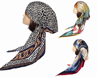 silk feel head scarf with long flowing tails. Mixed prints stripes checks  in red black white and pink pre-tied.