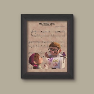 May include: A framed print of sheet music for the song "Married Life" from the Disney Pixar movie "Up". The sheet music features a cartoon image of Carl and Ellie from the movie.