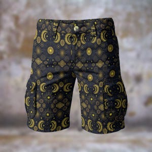 May include: Dark blue cargo shorts featuring a gold celestial pattern of moons, suns, and stars. The shorts have two side pockets and a button closure. The design covers the entire garment.