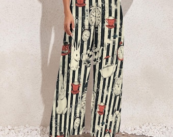 May include: Wide-leg pants with a black and cream vertical stripe pattern. The pants feature illustrations of clocks, teacups, teapots, and white rabbits. The design has a vintage, storybook aesthetic.