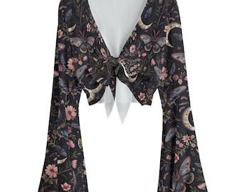 May include: A black tie-front top with long, flared sleeves. The top features a floral and butterfly pattern with pink and blue accents. The neckline is a deep V-shape.
