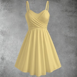 May include: A light yellow dress with spaghetti straps and a V-neckline. The bodice features a wrapped design, and the skirt flares out from the waist. The dress is made of a soft, flowing fabric.