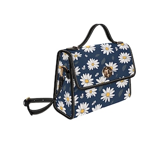 Crossbodytas met madeliefjesbloemen: reistas van zeildoek met zwarte riem