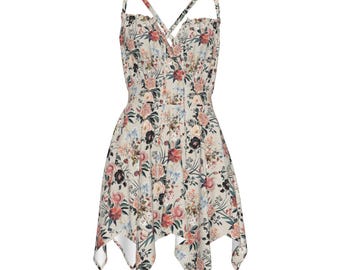 Vestido lencero con estampado floral: vestido veraniego bohemio sin mangas con bajo asimétrico.