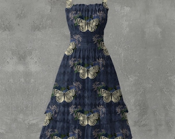 May include: A navy blue dress with a butterfly and floral pattern. The dress features a tiered skirt and adjustable straps. The butterflies are cream-colored with detailed wings, and the flowers are blue and green.