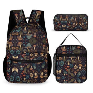 May include: A three-piece school backpack set featuring a dark blue backpack, a lunch bag, and a pencil case. All three pieces have a dark background with a colourful floral pattern featuring mushrooms and butterflies.