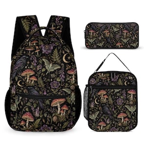 May include: A black backpack, a rectangular pencil case, and a lunch bag, all featuring a repeating pattern of purple flowers, red mushrooms, green ferns, moths, crescent moons, and black ravens on a dark background with black zippers.