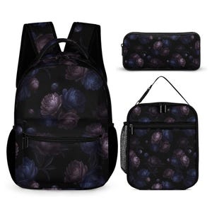May include: A black backpack, a rectangular pencil case, and a lunch bag, all featuring a dark floral pattern with purple and blue peony-like flowers. The backpack includes a front zippered pocket and side mesh pockets, while the lunch bag has a top handle.