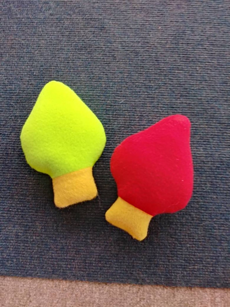 red squeaky dog toy