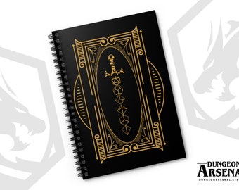 May include: A black spiral notebook with a gold design featuring a sword and dice. The design is framed with an ornate border. The notebook says "Dungeon Arsenal" on the bottom.