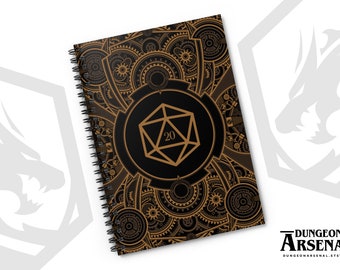 May include: A black and gold spiral notebook with a steampunk design featuring gears and a 20-sided die. The notebook cover has the text "Dungeon Arsenal" and a website address.